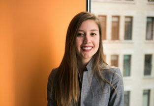 shallow focus photo of woman in gray jacket